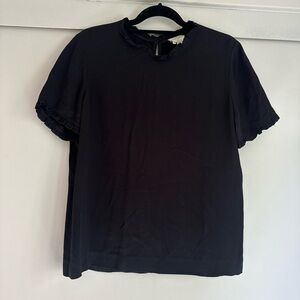 Kate Spade black short sleeve shirt. Ruffle detail at neck and sleeve.